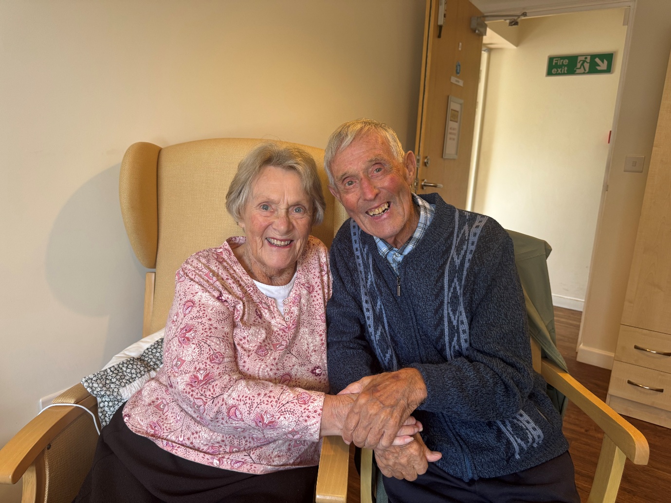 Julia and Reg Bale at Harbour Rise respite care in Paignton Julia and Reg Bale smiling and holding hands during Julia’s respite stay at Harbour Rise care home in Paignton
